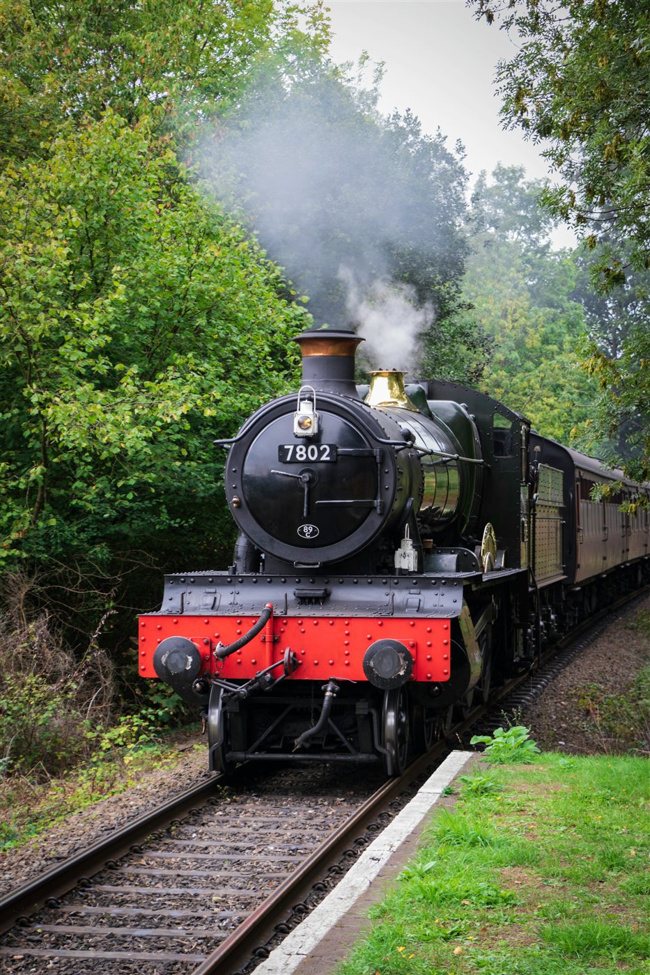 A steam locomotive emitting steam