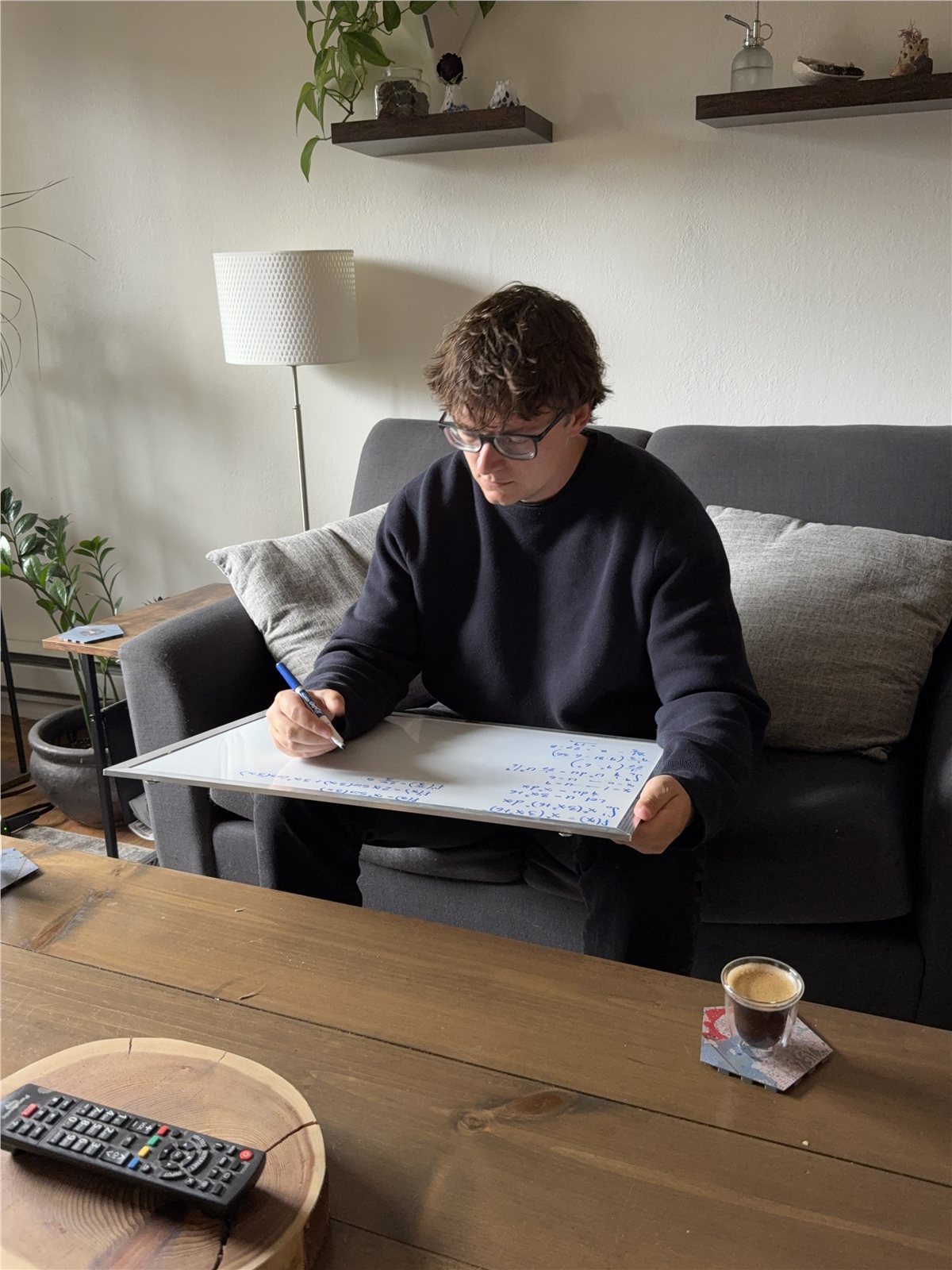 Matt Heywood working through a calculus problem on a whiteboard